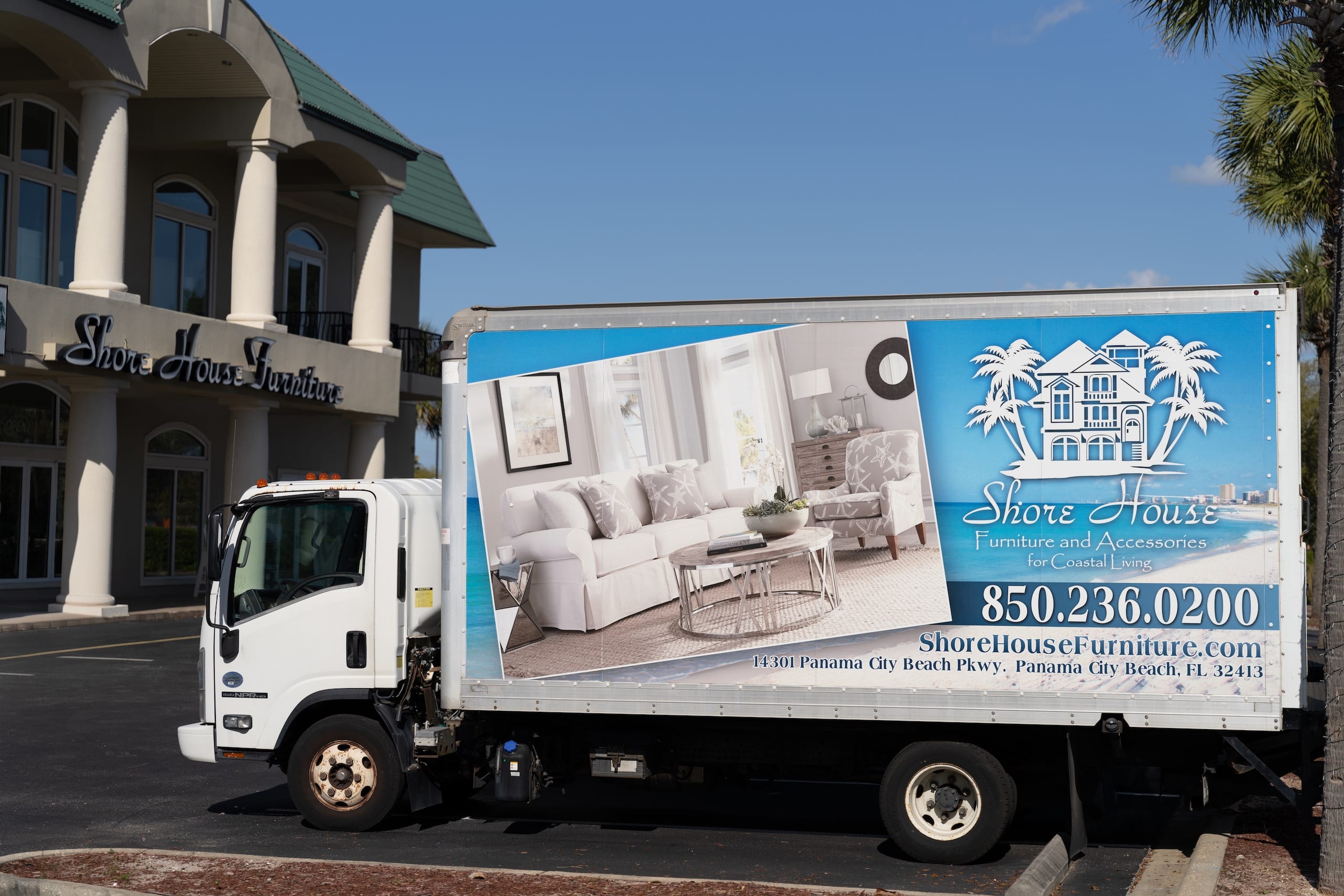 Shore House Furniture moving van near the store front on Panama City Beach Parkway