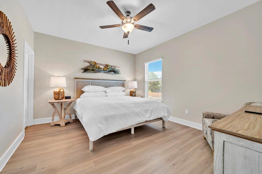 coastal designed guest bedroom with beachy white accessories designed and decorated by Shore House Furniture in Panama City Beach Florida