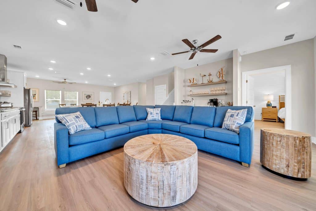 coastal designed living room with beachy white and blue accessories designed and decorated by Shore House Furniture in Panama City Beach Florida