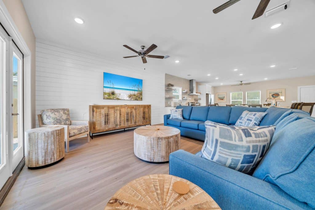 coastal designed living room with beachy white and blue accessories designed and decorated by Shore House Furniture in Panama City Beach Florida