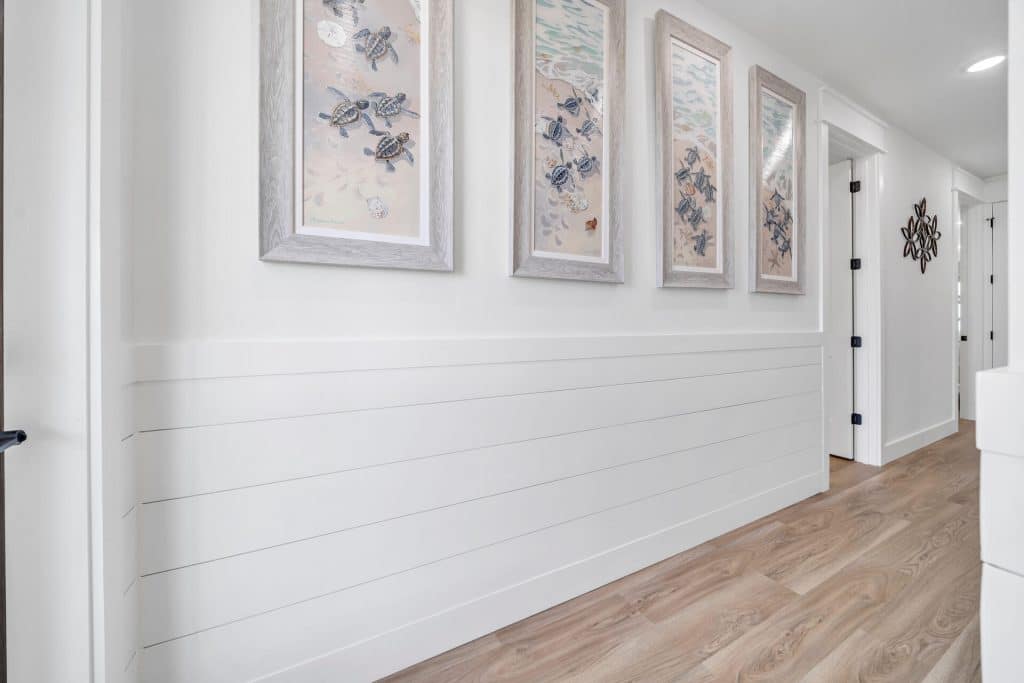 coastal designed home with white ship boards beachy accessories designed and decorated by Shore House Furniture in Panama City Beach Florida